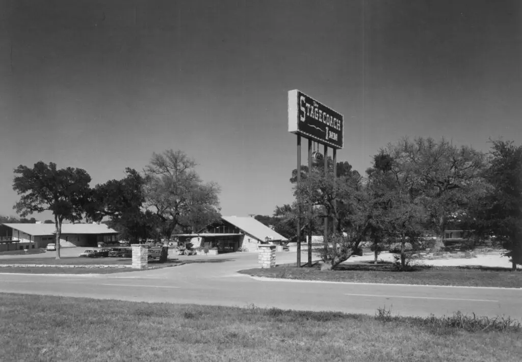 Historic view of the Stagecoach Inn in Salado, Texas, with the original signage and buildings.